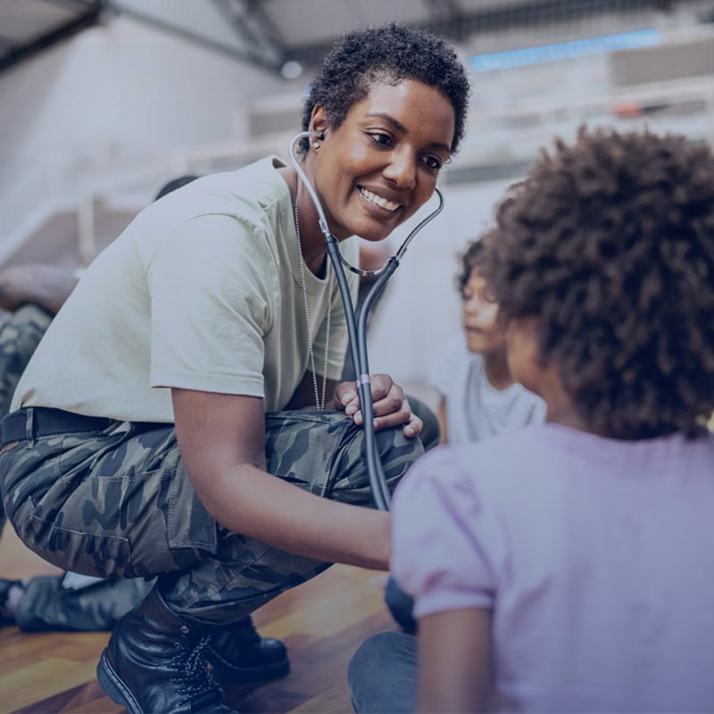 female army vet treating a young patient