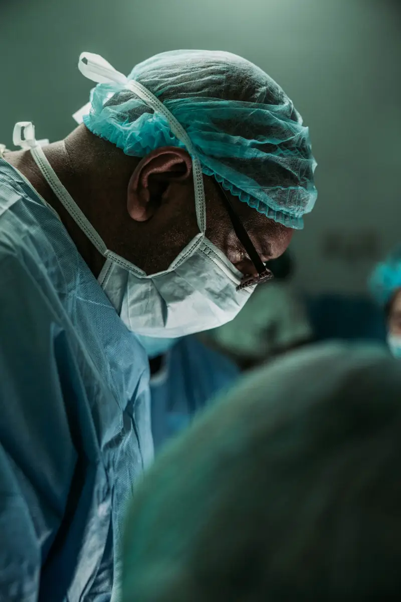 African American doctor performing surgery